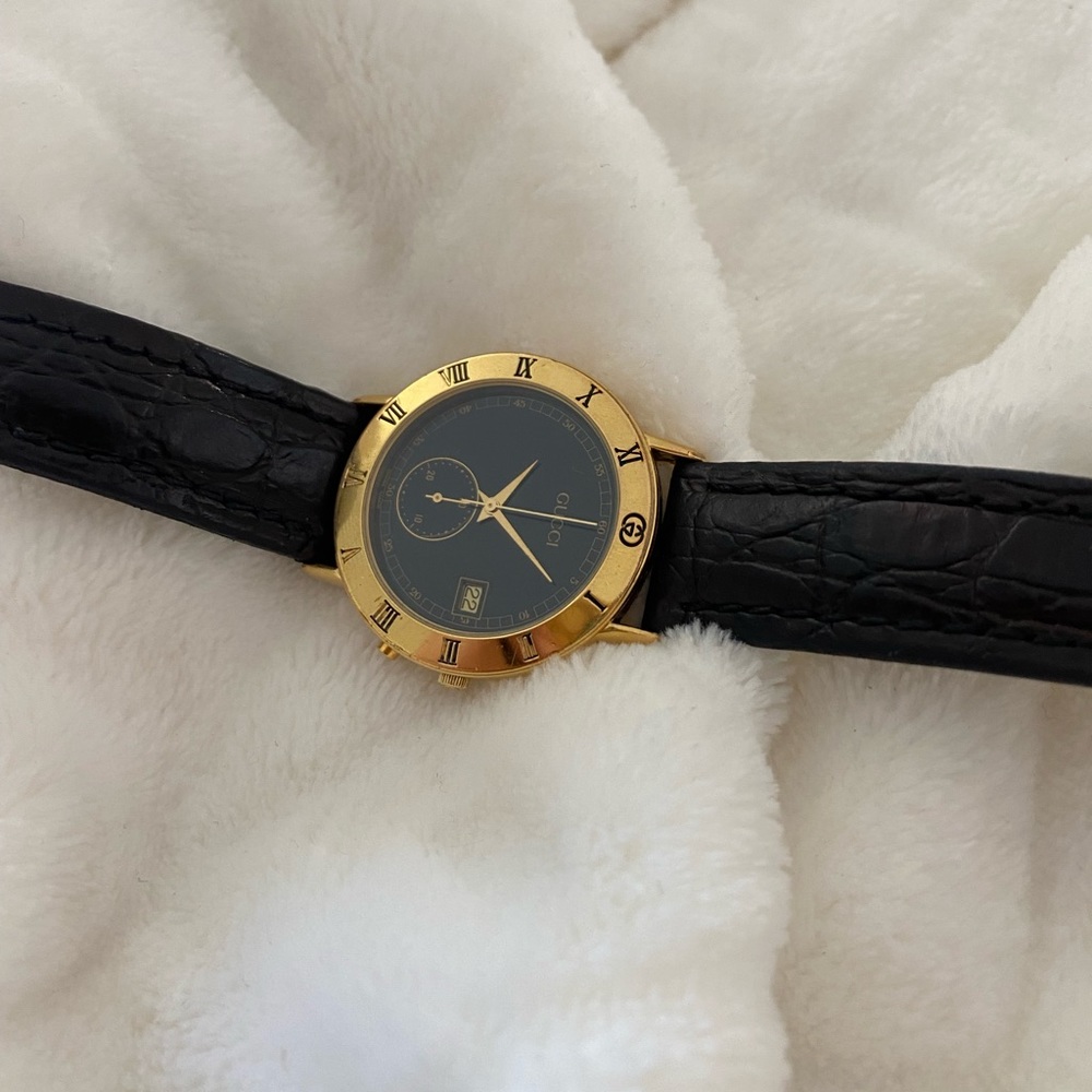 Vintage black and gold Gucci watch